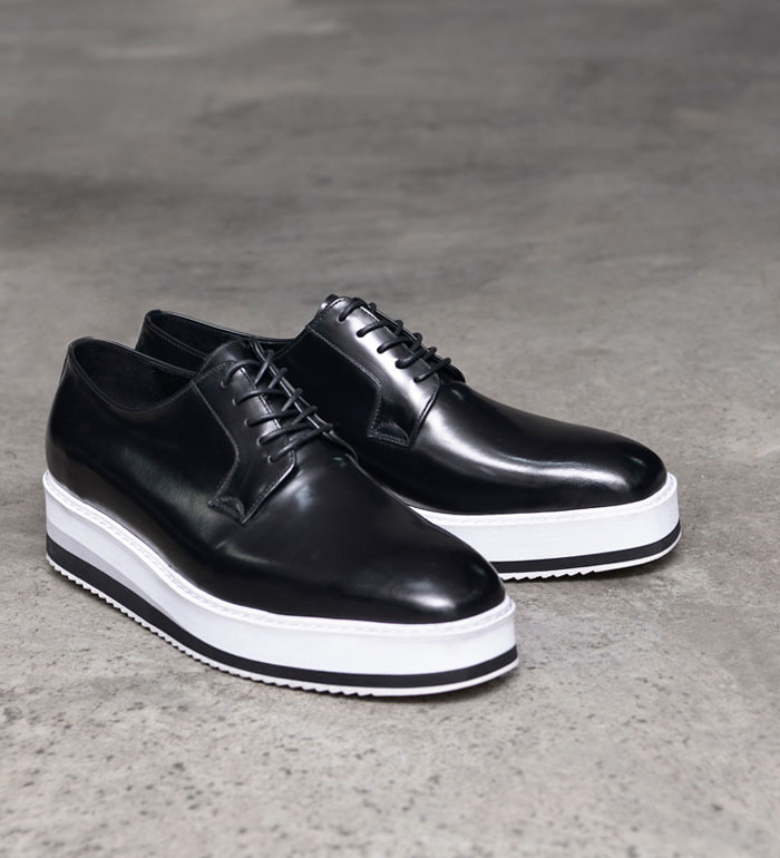 black leather sneaker with white sole